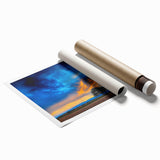 Vibrant rolled canvas print showcasing a serene landscape with rolling fields and a colorful sunset, elegantly packaged in a protective cardboard tube for easy transport.