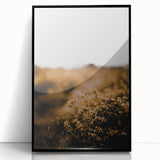 Large abstract wall art featuring autumnal colors on a black framed acrylic, ideal for modern living room decor.