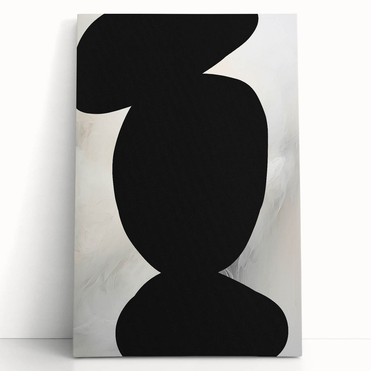 Abstract minimalist wall art on stretched canvas showcasing soft pastel colors and geometric shapes, elegantly leaning against a neutral wall for a modern decor touch.