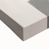 Close-up of an abstract minimalist wall art piece on stretched canvas, showcasing soft pastel colors and geometric shapes, designed to enhance modern decor.