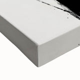 Close-up of a stretched canvas featuring abstract minimalist wall art with soft pastel colors and geometric shapes, perfect for modern home decor.