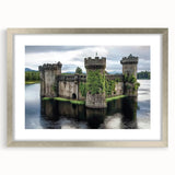 Elegant silver-framed landscape art featuring a majestic castle, displayed with a white mat for added contrast, ideal for enhancing home decor or office spaces.