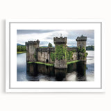 Elegant white-framed landscape artwork showcasing a majestic castle surrounded by lush greenery, expertly matted for a refined presentation, ideal for home decor.