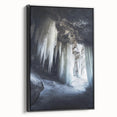 Framed canvas artwork showcasing a stunning landscape scene with intricate cave details, presented in a sleek black frame, perfect for modern home decor.