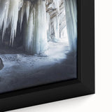 Close-up of a framed canvas artwork depicting vibrant landscapes and caves, showcasing intricate details and rich colors, perfect for home decor.