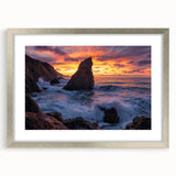 Framed landscape art print showcasing dramatic cliffs in vibrant colors, bordered with a sleek silver mat, ideal for enhancing home decor and creating a serene atmosphere.