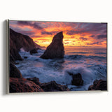 Framed canvas artwork showcasing a breathtaking cliff landscape with vibrant colors, elegantly displayed with a silver frame for a modern touch.