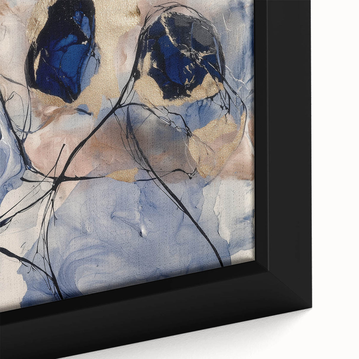 Close-up of a framed abstract canvas showcasing vibrant splatter designs in hues of blue, orange, and yellow, perfect for modern home decor accents.