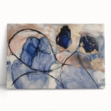 Abstract canvas art print showcasing vibrant splatters in hues of blue, pink, and yellow, perfect for modern home decor. The artwork leans against a neutral wall, adding a splash of color to the setting. Ideal for enhancing living spaces with a bold artistic statement.