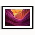 Framed landscape artwork showcasing vibrant canyons in rich earth tones, featuring a sleek black mat and elegant frame, ideal for enhancing home decor.