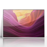 Framed acrylic artwork depicting a vibrant landscape of canyons in warm earthy tones, set against a white background, ideal for modern home decor.