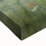 Close-up of a stretched canvas wall art piece depicting a serene countryside landscape with lush greenery and vibrant colors, ideal for home decor.