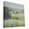 Stretched canvas wall art depicting a serene countryside landscape with vibrant green fields and a blue sky, viewed from the side, ideal for home decor.