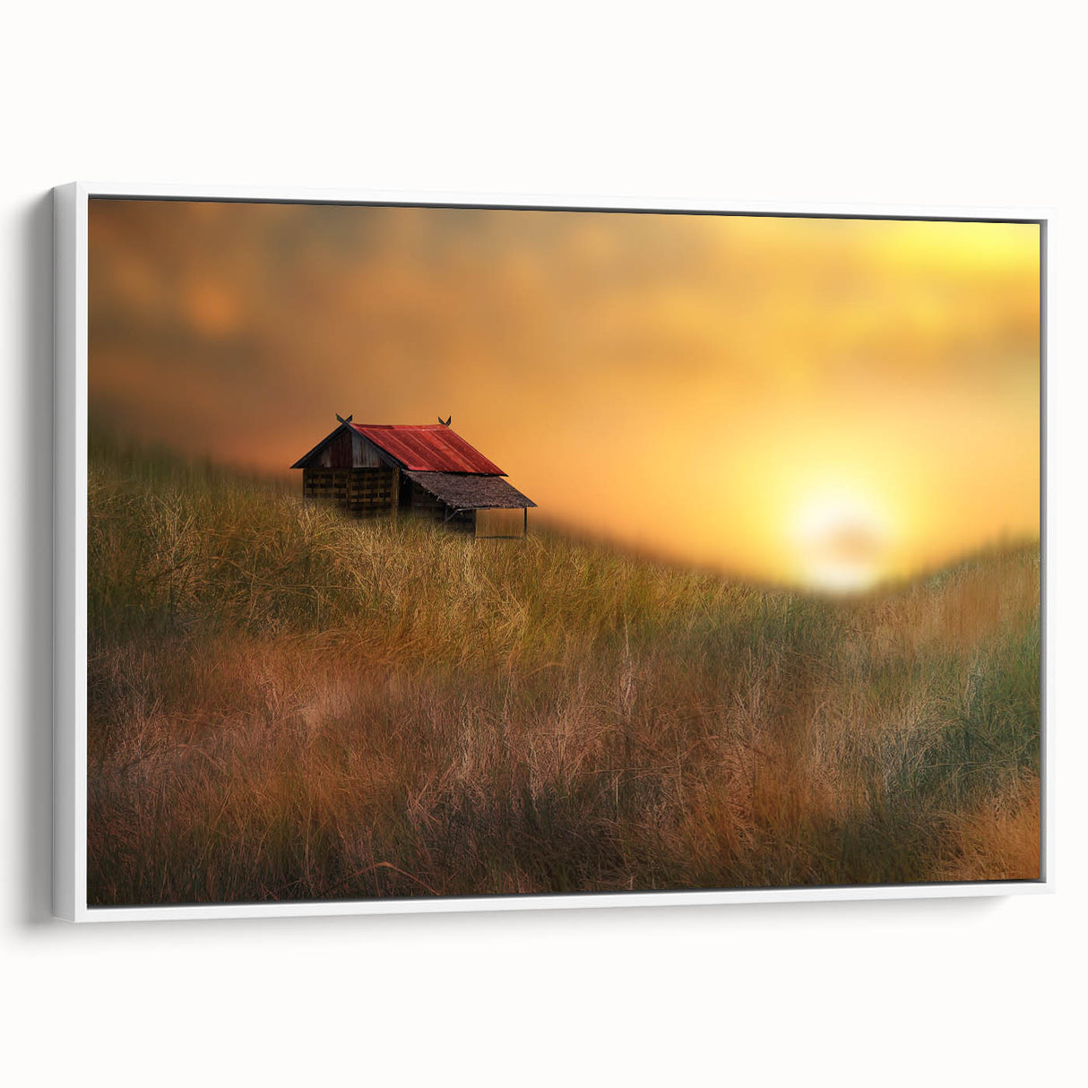 Framed canvas artwork depicting a serene countryside landscape, featuring lush green fields and a clear blue sky, elegantly displayed with a white frame.