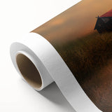 Rolled canvas artwork depicting a serene countryside landscape, showcasing vibrant greenery and rolling hills, elegantly packaged in a protective cardboard tube for safe transport.