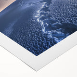 Rolled canvas artwork showcasing a vibrant desert landscape with warm hues of orange and yellow, ideal for home decor and interior design enthusiasts.