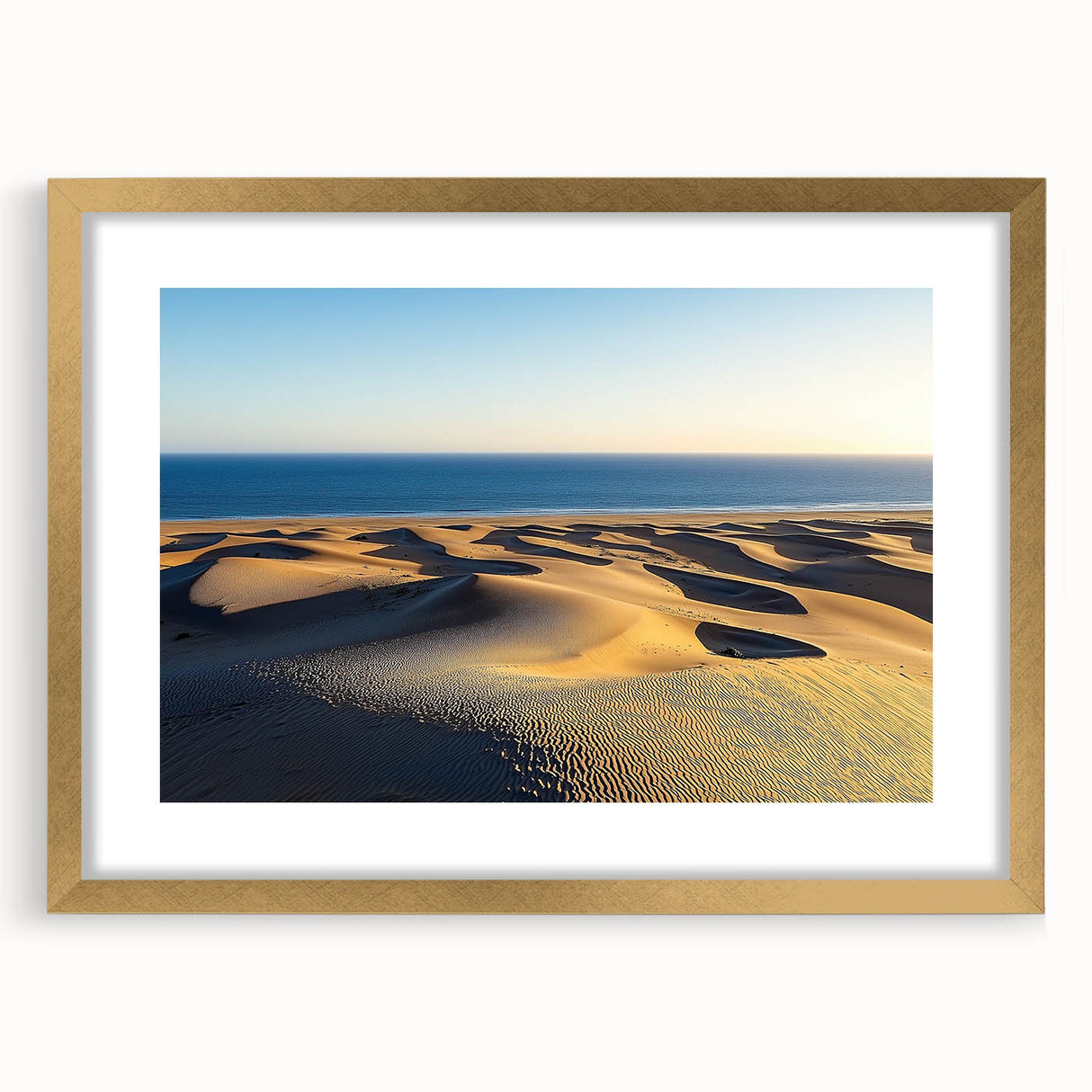 Framed landscape artwork showcasing serene sand dunes in warm gold tones, elegantly matted for display, perfect for home decor and interior design enhancement.