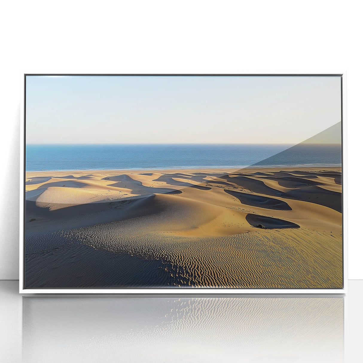 Framed acrylic artwork showcasing a serene landscape of sand dunes, featuring soft beige and golden tones, perfect for home decor and enhancing modern interiors.