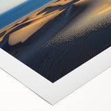 Rolled canvas print showcasing a vibrant desert landscape featuring golden sand dunes under a clear blue sky, designed to enhance any room's decor.