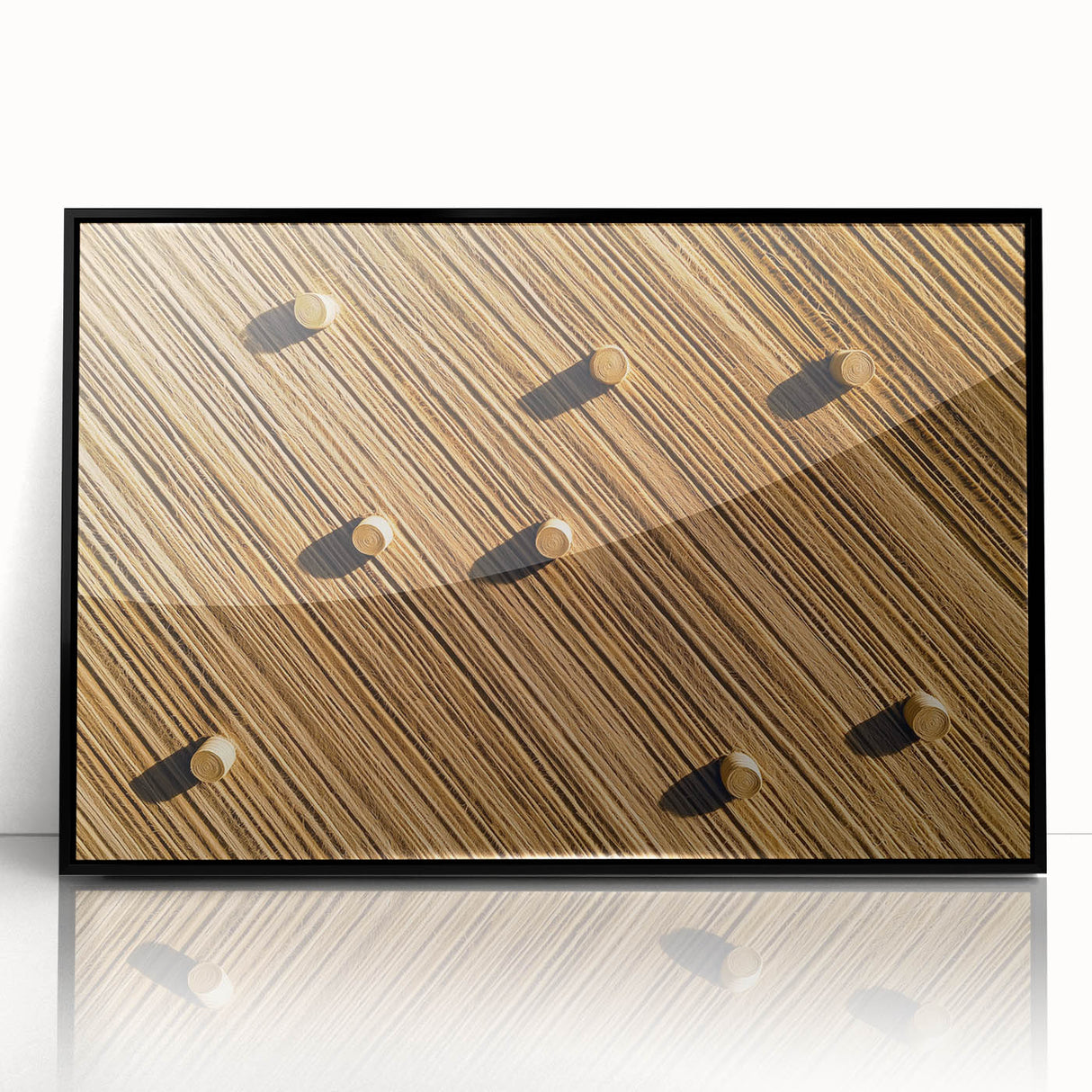 Framed acrylic artwork depicting a vibrant landscape with fields in rich greens and golds, showcasing a black frame that enhances its visual appeal for home decor.