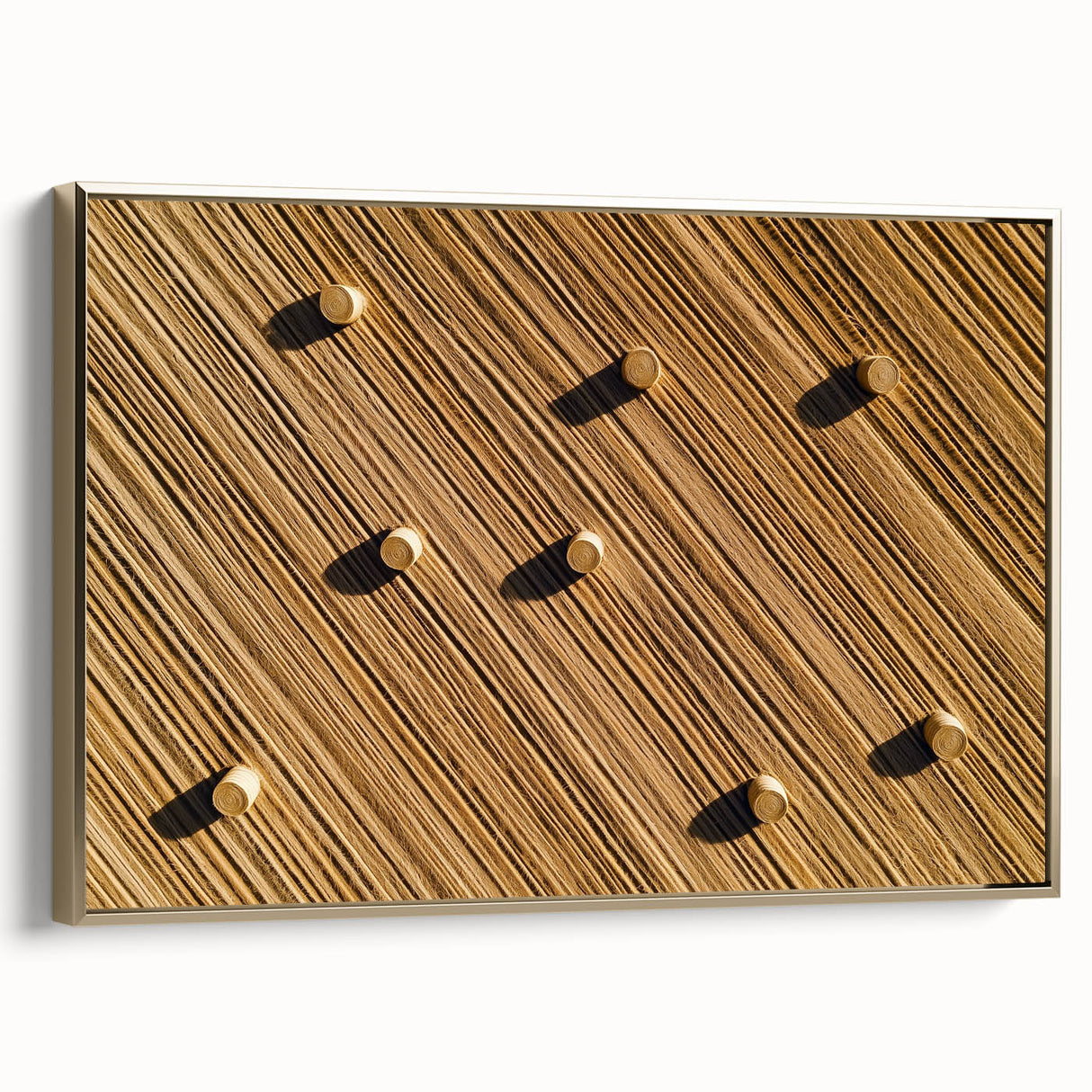 Framed canvas artwork showcasing a vibrant landscape field scene with golden accents, ideal for home decor, displayed from a side view to highlight its elegance.