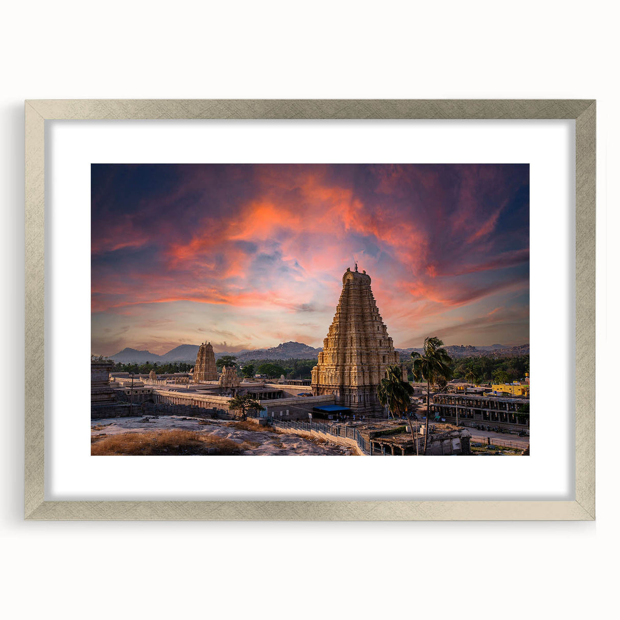 Textured art print featuring abstract shapes in earthy tones, framed in silver, ideal for bedroom art.