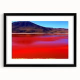Extra large abstract art print of a colorful Bolivian landscape on textured canvas, framed in black.