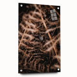 Large abstract wall art depicting autumnal trees in vibrant orange and red tones on acrylic glass.