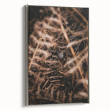 Framed canvas of a vintage landscape painting featuring colorful autumn trees against a black background.