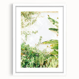 Abstract art print featuring swirling spring hues on a white framed canvas, ideal for dining room decor.