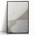 Framed abstract minimalist wall art displaying a sleek black design, set against a clean background, perfect for modern home decor. This striking piece enhances any interior space with its contemporary elegance.