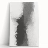 Abstract minimalist wall art on stretched canvas, featuring soft earth tones and geometric shapes, leaning against a white wall, enhancing modern décor.