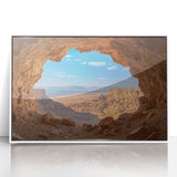 Framed acrylic artwork depicting a serene cave landscape, featuring earthy tones and intricate details, presented in a sleek white frame for a modern aesthetic. Ideal for enhancing contemporary home decor.