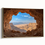 Framed canvas artwork depicting a stunning landscape scene with intricate cave formations, featuring a gold frame that enhances the visual appeal, perfect for home decor.
