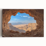Vibrant stretched canvas artwork depicting a serene landscape with intricate cave formations, ideal for home decor, showcasing earthy tones and expansive scenery.