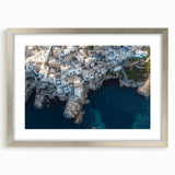 Framed landscape artwork showcasing dramatic cliffs in a silver mat, perfect for enhancing home decor with its modern aesthetic and captivating nature scene.