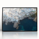 Framed acrylic artwork showcasing a dramatic landscape of rugged cliffs against a vibrant sunset, with a sleek black frame enhancing its modern aesthetic. Perfect for home decor or office spaces.