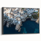 Framed canvas artwork depicting a stunning landscape of dramatic cliffs against a clear blue sky, featuring a sleek black frame and side view for modern decor appeal.