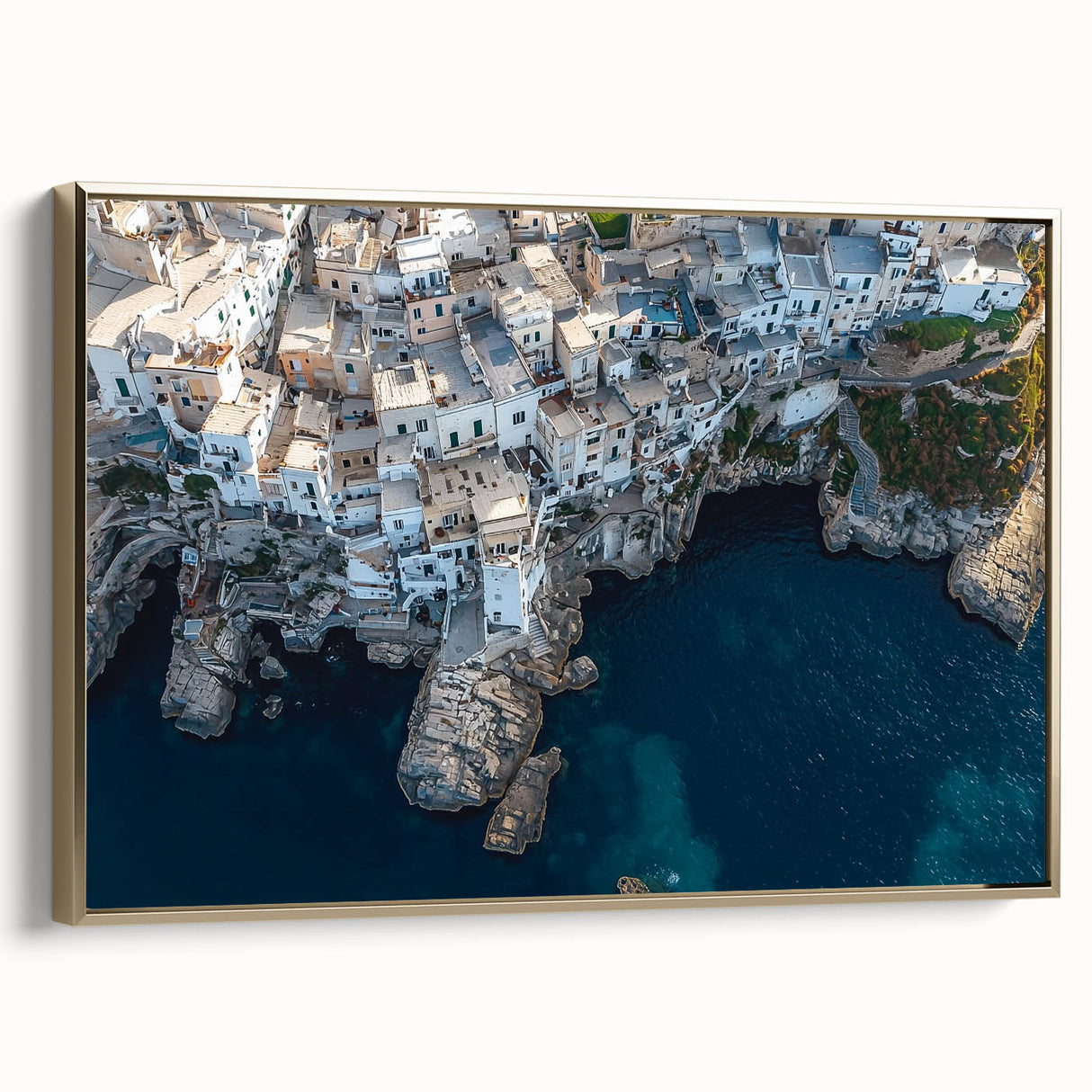 Framed canvas artwork depicting a stunning landscape of cliffs, highlighted by a gold frame, ideal for home decor and enhancing interior aesthetics.