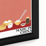 Close-up of a black framed canvas featuring a textured depiction of colorful food dishes, ideal for large living room walls.