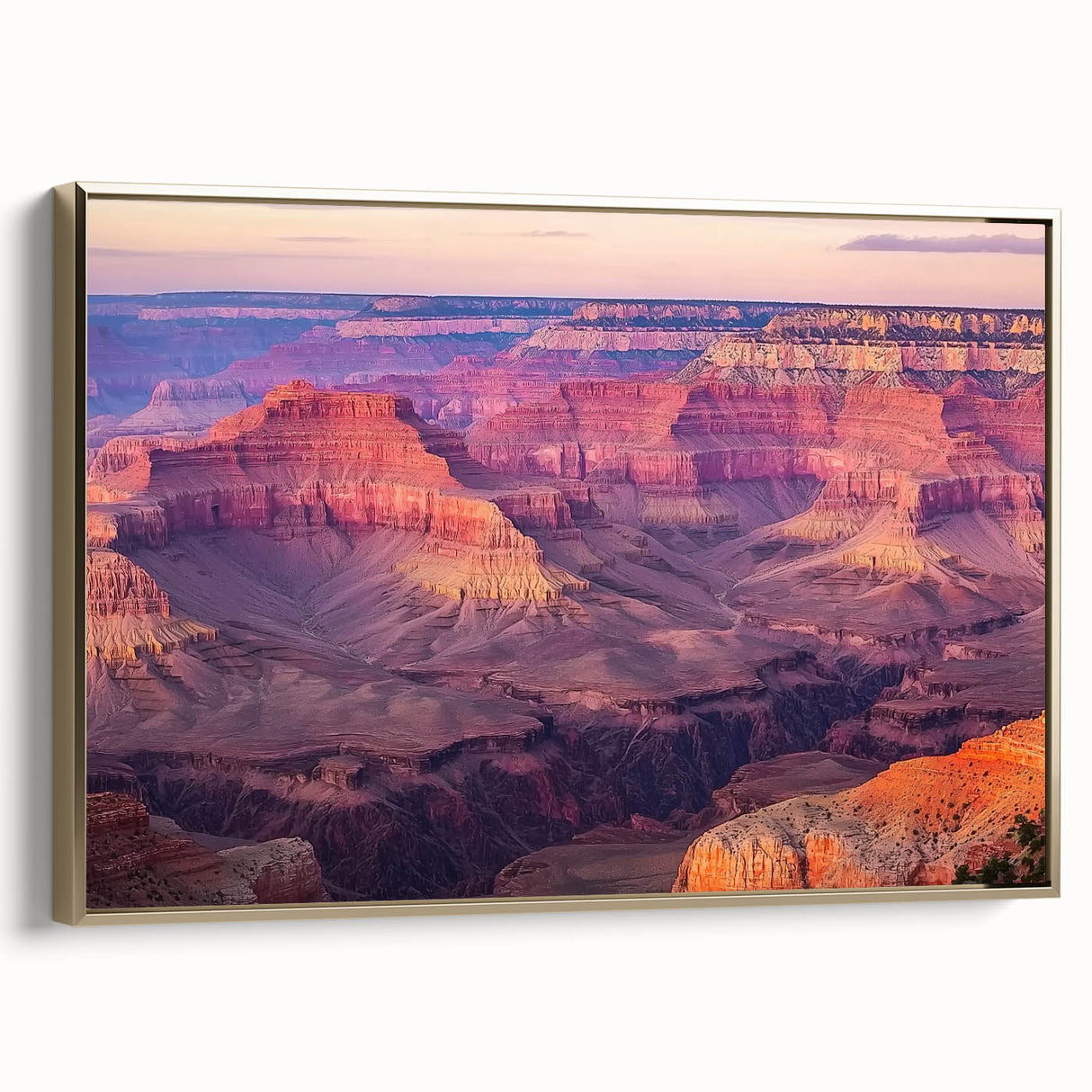 Framed canvas artwork depicting a stunning landscape of canyons with vibrant colors, featuring a gold frame that enhances its elegant appeal, ideal for home decor.