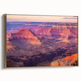 Framed canvas artwork depicting a stunning landscape of canyons with vibrant colors, featuring a gold frame that enhances its elegant appeal, ideal for home decor.