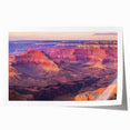 Landscape canyon rolled print showcasing vibrant hues of orange and blue, depicting majestic rock formations under a clear sky, ideal for home decor.