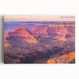 Stretched canvas artwork depicting a vibrant landscape of canyons, showcasing rich colors and intricate details, perfect for home decor or office spaces.