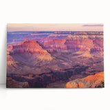 Stretched canvas artwork depicting vibrant canyons in a desert landscape, showcasing rich earthy tones and dramatic rock formations, perfect for home decor.