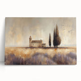 Stretched canvas artwork depicting a serene countryside landscape with vibrant green fields and a clear blue sky, leaning against a rustic wall for display.