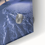 Close-up of a vibrant acrylic landscape artwork depicting a serene desert scene, showcasing rich hues of orange and yellow with intricate details on glass. Perfect for enhancing modern decor.