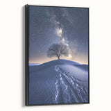 Framed canvas art depicting a vibrant desert landscape with warm hues of orange and yellow, showcased against a sleek black frame, perfect for modern home decor.