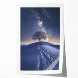 Desert landscape rolled canvas print showcasing vibrant hues of orange and yellow, depicting a serene sunset over sand dunes, beautifully packaged for display.