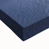 Close-up of a stretched canvas depicting a vibrant desert landscape with warm tones of orange and yellow, showcasing detailed textures and natural elements, perfect for home decor.